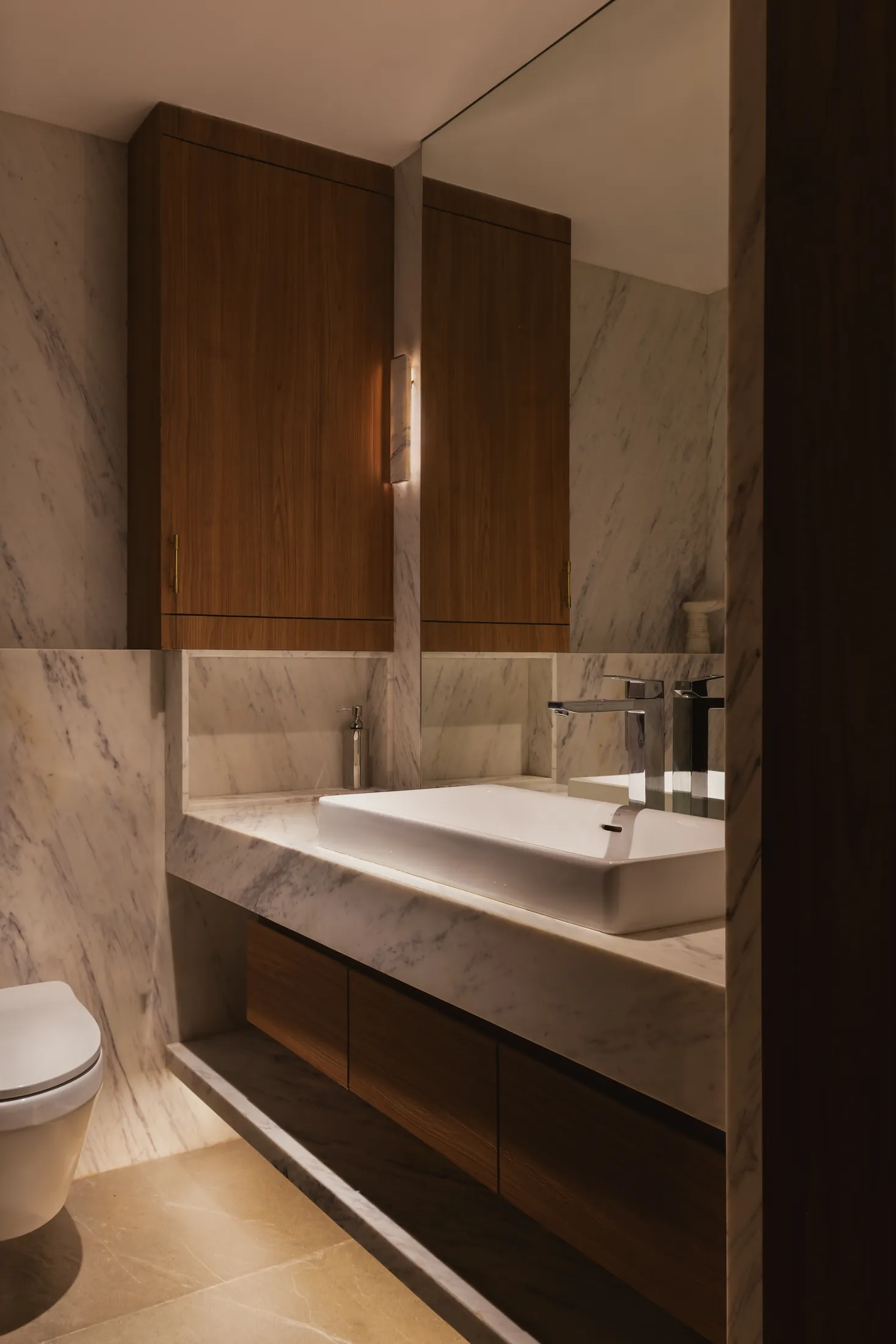 home in•between bathroom vanity with a stone counter, mirror cabinet and teak drawers