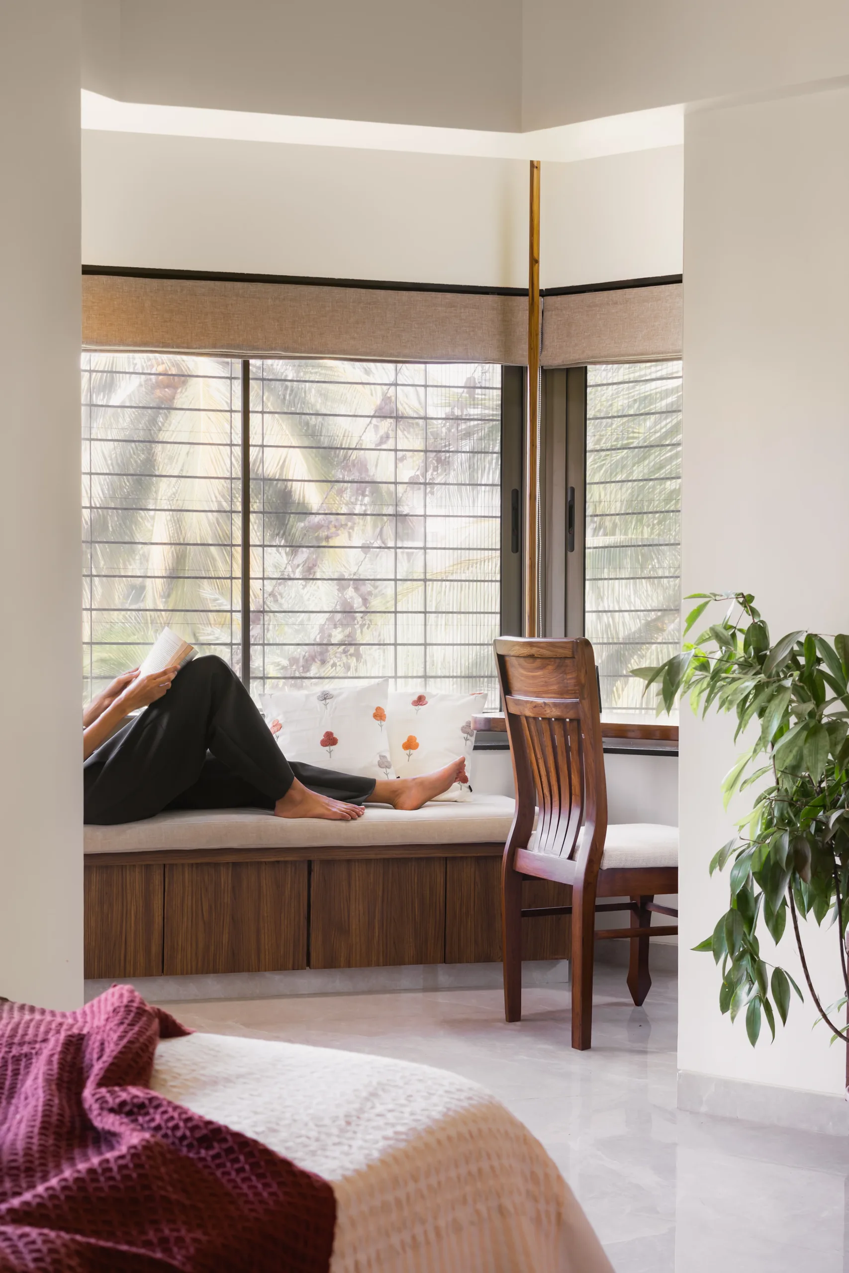 The Nest built-in window seat with cushions and timber drawers below a wide window